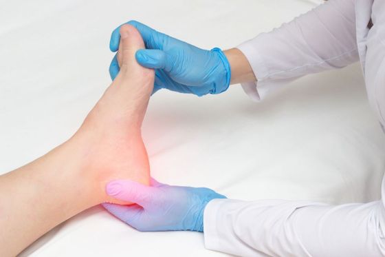 Person experiencing foot pain - Southern Delaware Foot Ankle